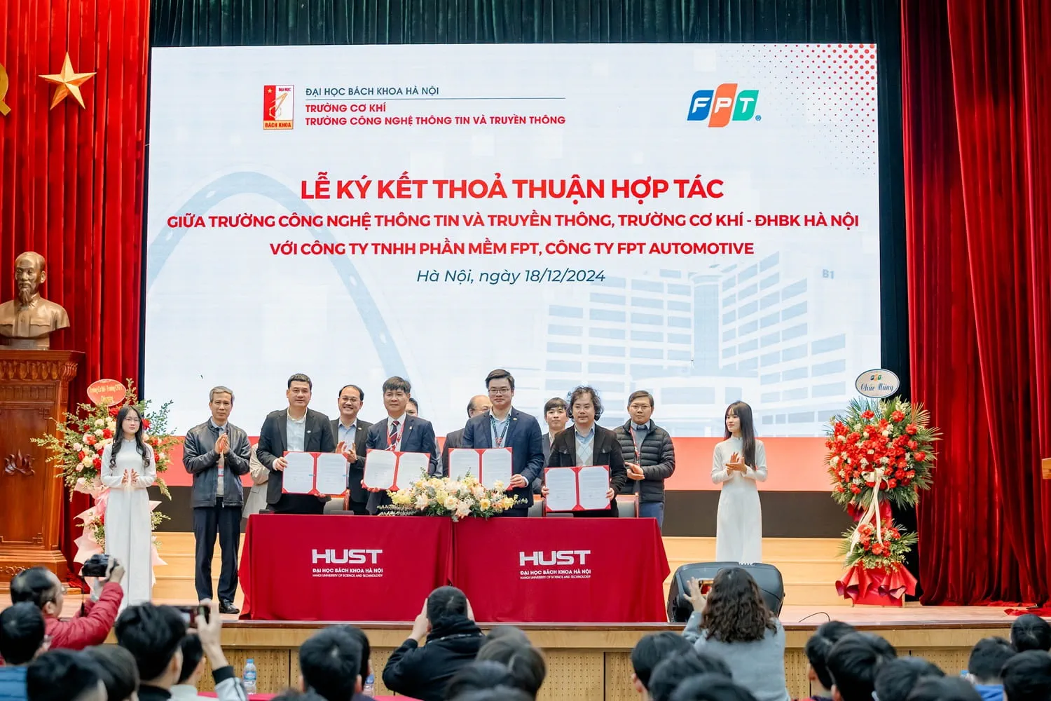 Signing ceremony between FPT, the School of Information and Communication Technology, and the School of Mechanical Engineering (HUST).