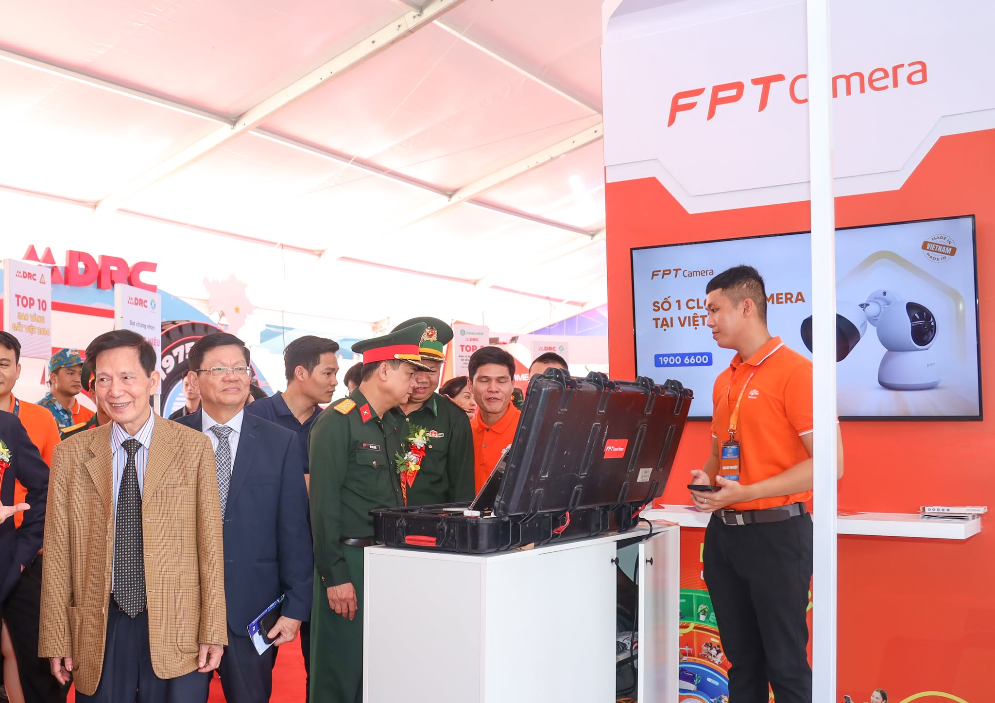Guests visit FPT booth at the event.
